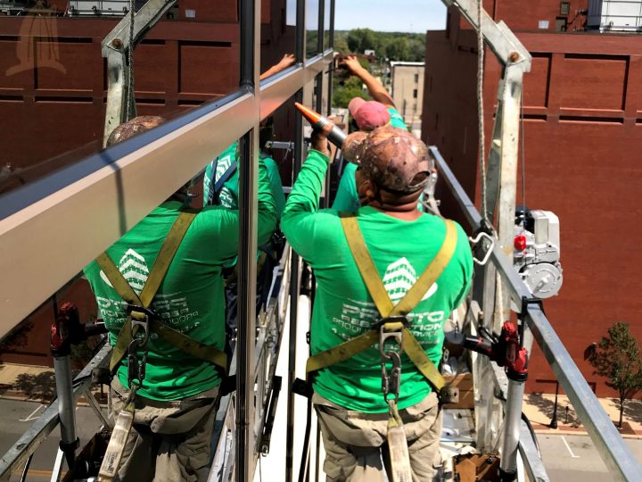 presto-technicians-caulking-high-rise-building Presto technicians caulking high rise building