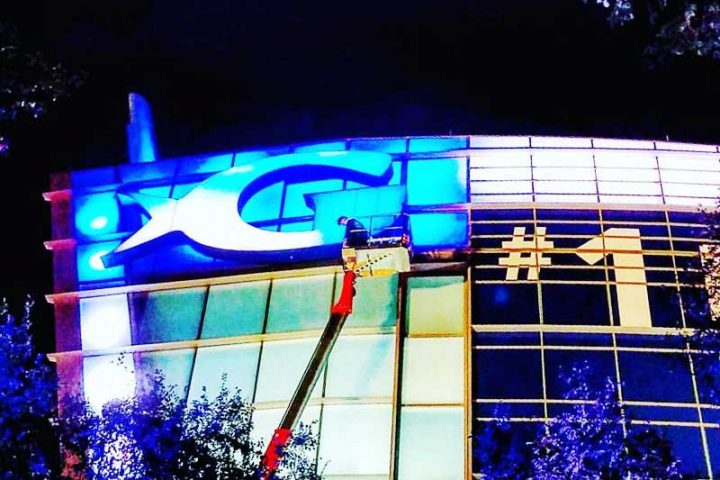 Working at night to restore the alucobond panels of the Georgia Aquarium