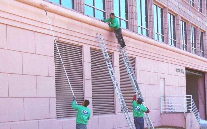 Elastomeric-Wall-Coatings-Services applying an elastomeric coating to a wall
