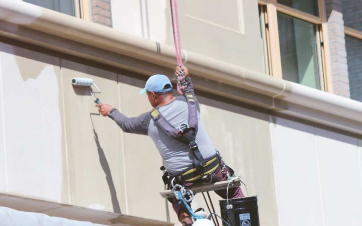 Commercial-Waterproofing-Companies Commercial waterproofing company applying waterproofing coating to exterior of building
