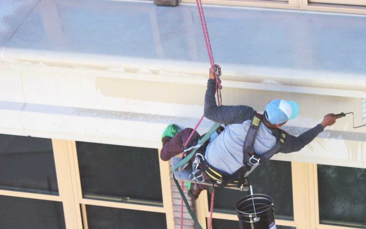 Applying a waterproofing solution to a commercial building