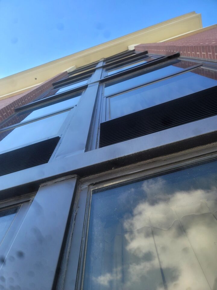 Commercial window caulking services on a building in Kansas City, MO