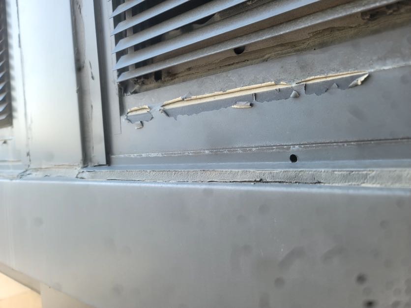 Failed window perimeter caulking on a commercial building facade in Kansas City, MO