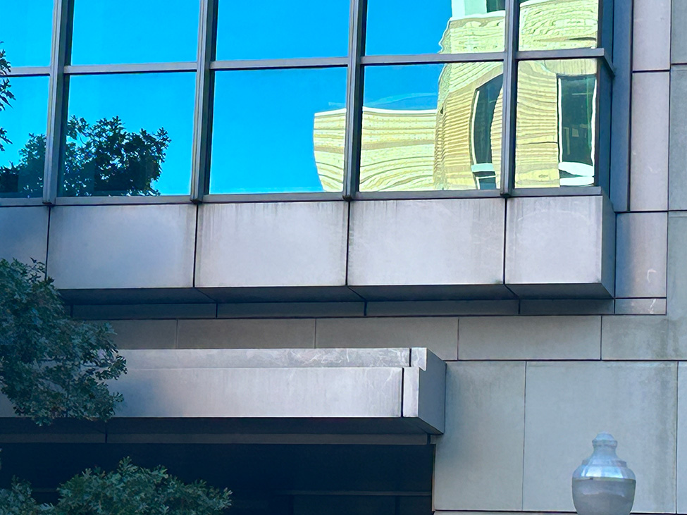 Natural stone facade and curtain wall caulking at Omni Fort Worth Hotel, Fort Worth, TX