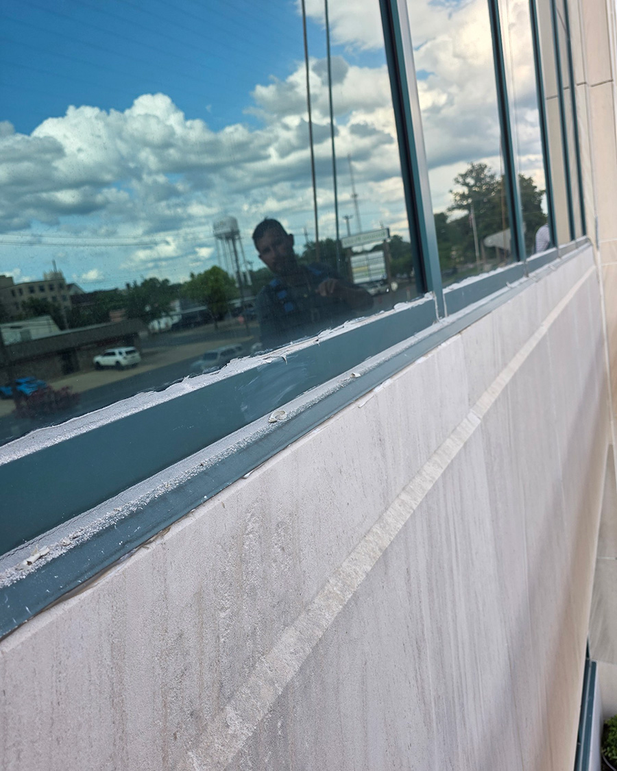 Failed Window Perimeter Caulking on Building Exterior in El Dorado, AR