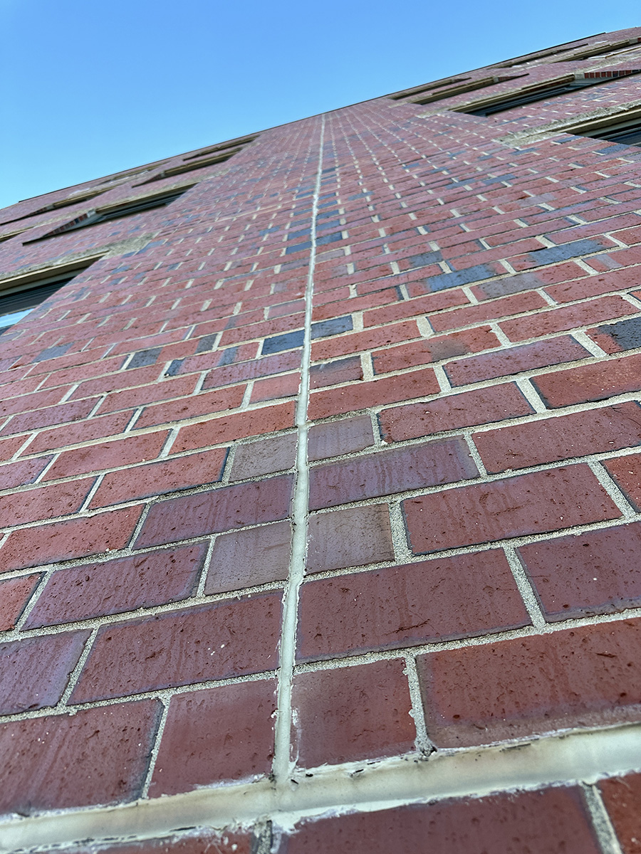 Control joint caulking repair at a commercial building in Portland, ME