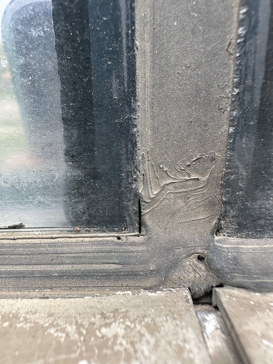 Deteriorated wet glazing sealant at a commercial building in Grand Rapids, MI