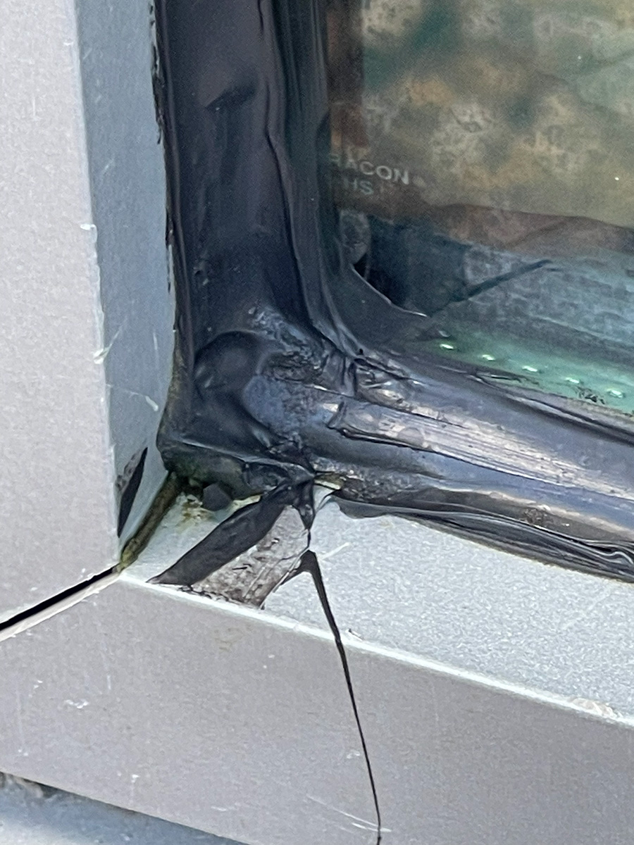 Failed glass-to-metal caulking at a commercial office building in Tampa, FL