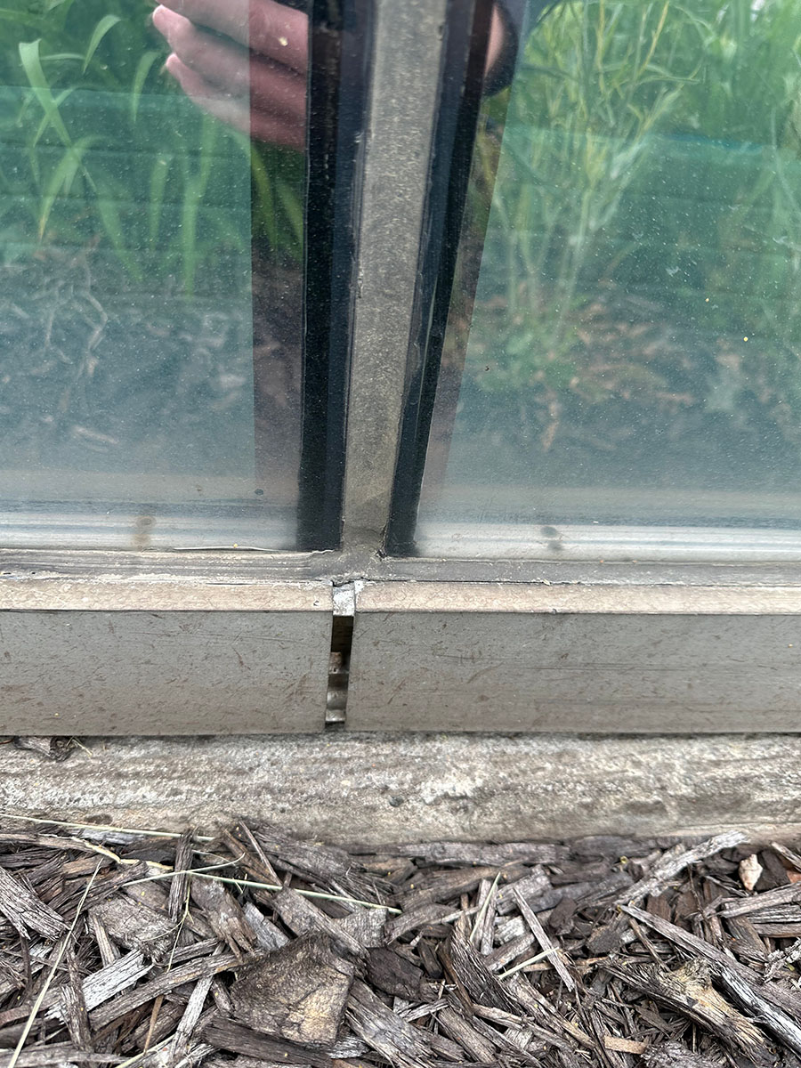 Failed window perimeter caulking requiring repair at a commercial building in Grand Rapids, MI