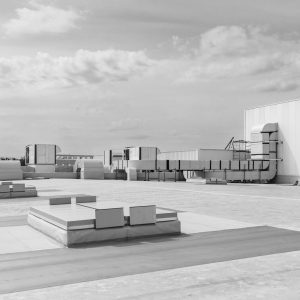 Commercial roof coating application on a San Antonio TX low-slope roof